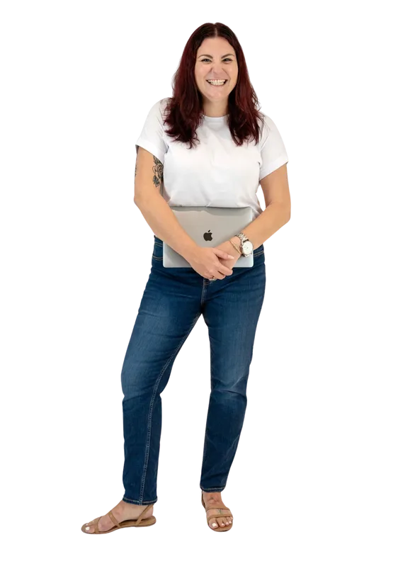 Renaee McSwan, founder of Mac & Co Lending, holding a laptop